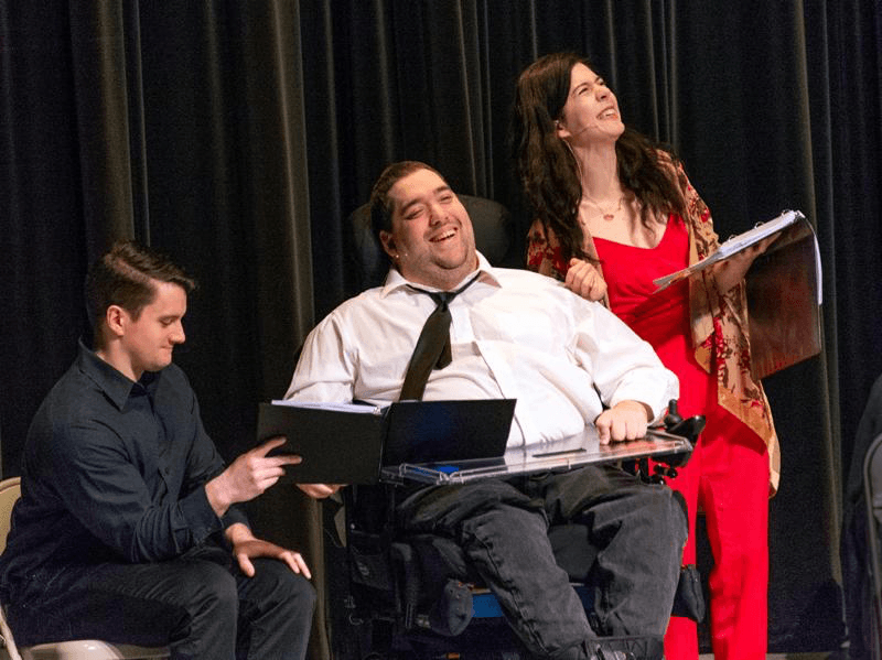 Artist Christopher Saglimbene performing on stage at the Robert Schonhorn Arts Center.