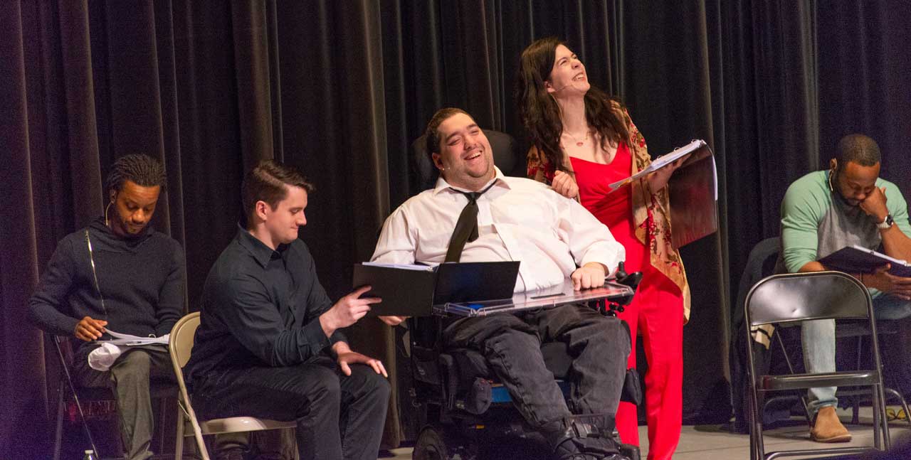 Artist Chrisopher Saglimbene performing on stage at the Robert Schonhorn Arts Center.