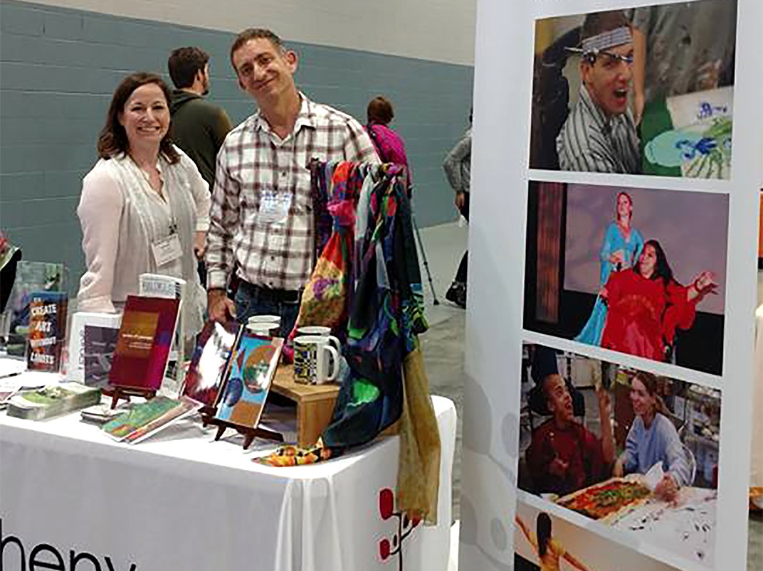 Arts Access display and staff members Heather Williams and Peter Geissner at Abilities Expo 2017.