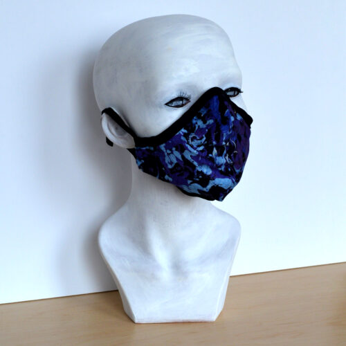 Face covering based on painting by artist Cheryl Chapin titled "The Blues".
