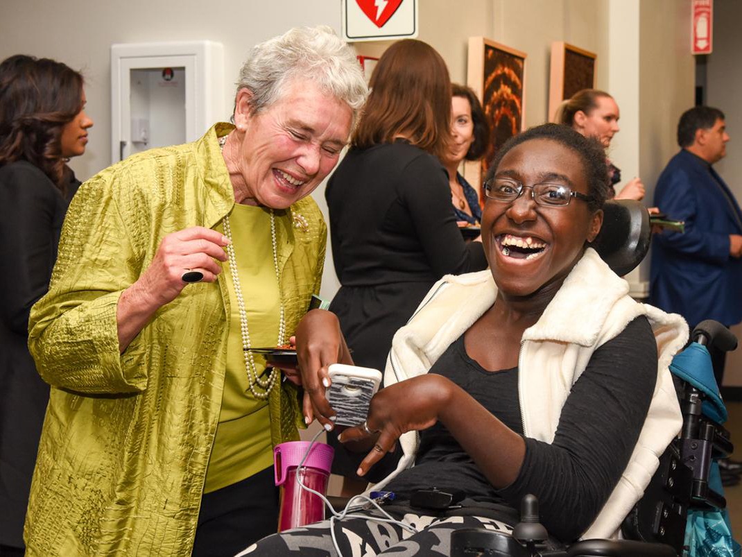 Artist Raven Bennet attending reception in the Robert Schonhorn Arts Center gallery.