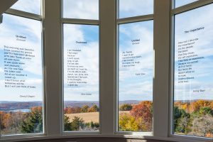 Robert Schonhorn main gallery featuring the creative writing on four windows by artists Cheryl Chapin, Dion Alston, Faith Stolz and Jenny Durr.