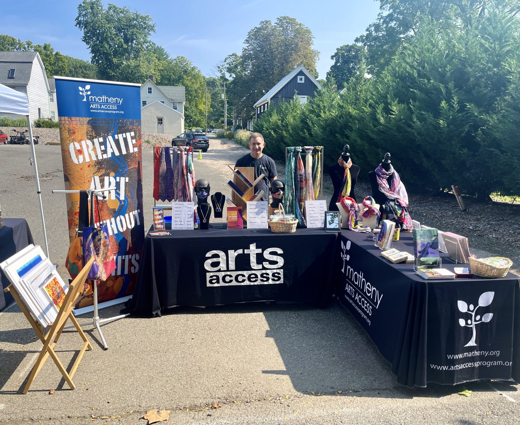 Arts Access merchandise display at Art in the Park in Peapack New Jersey.