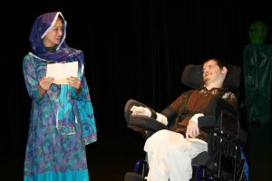 Artist Michael Cornelly performing on stage in the Robert Schonhorn Arts Center.