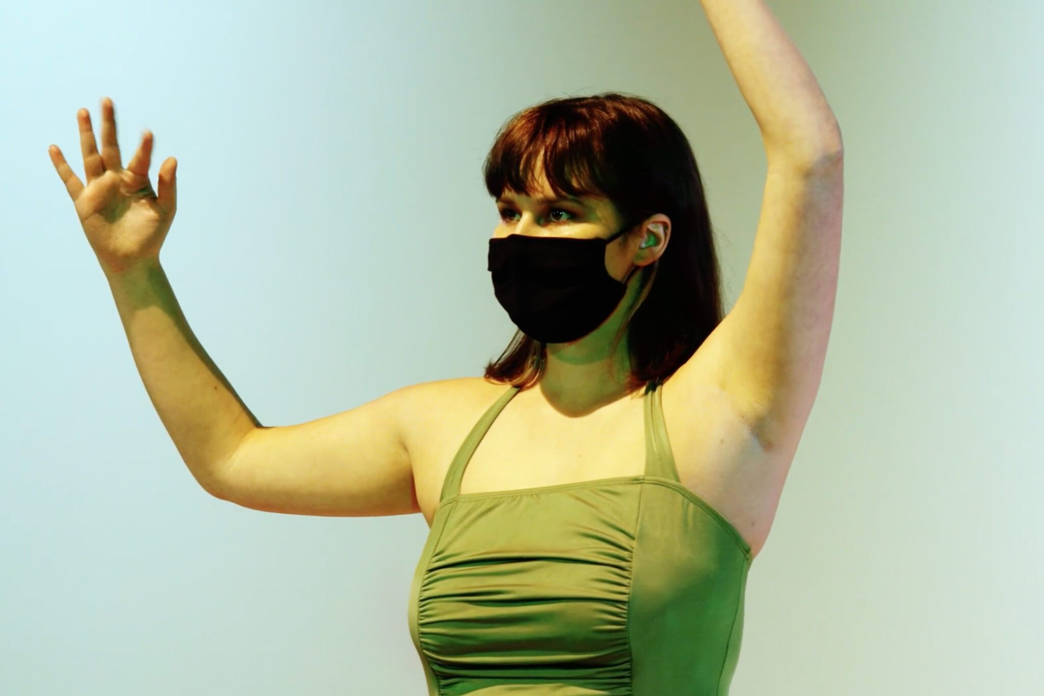 Close up of Dance Facilitator Alyssa Thostesen performing on stage at the Robert Schonhorn Arts Center.
