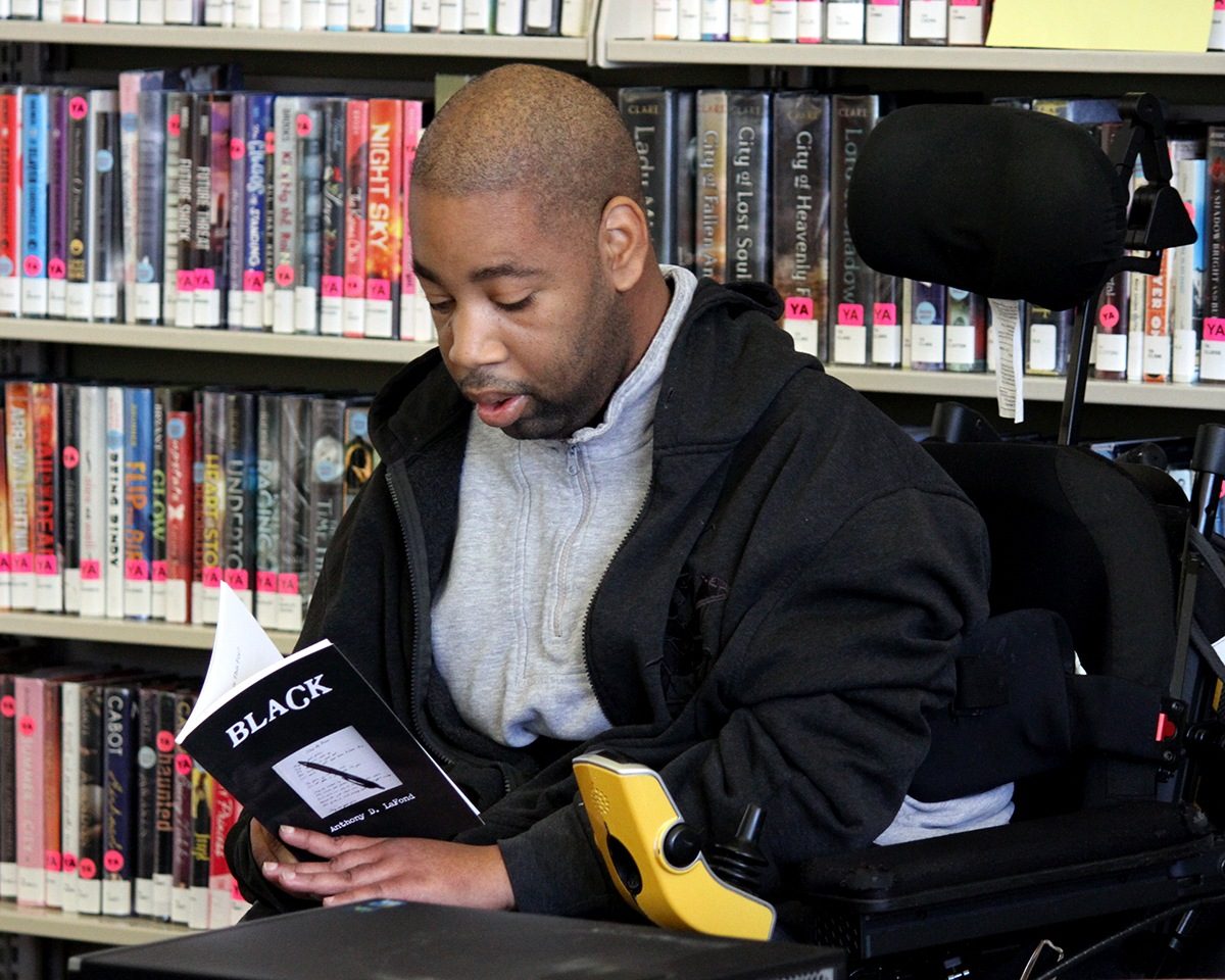 Artist Anthony D. LaFond reading the book he authored, titled "Black".