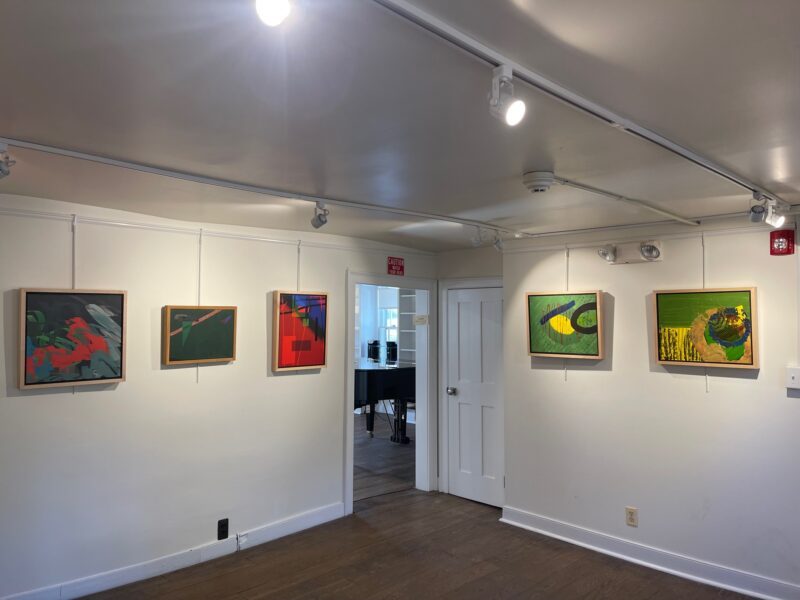 Farmstead Arts gallery with exhibited paintings by Arts Access artists.