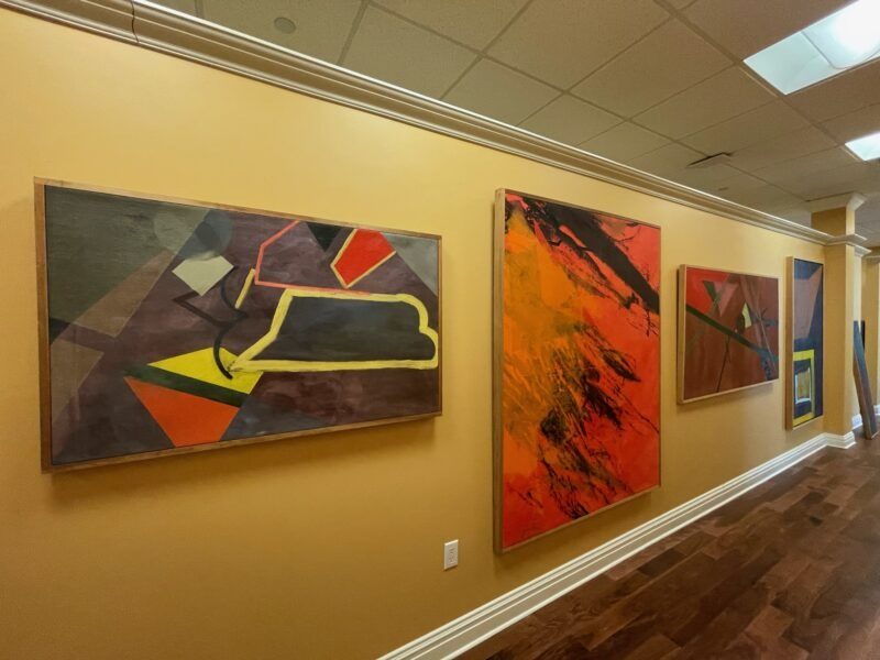 Paintings by Arts Access artists displayed at Peapack Gladstone Bank in Teaneck, New Jersey.