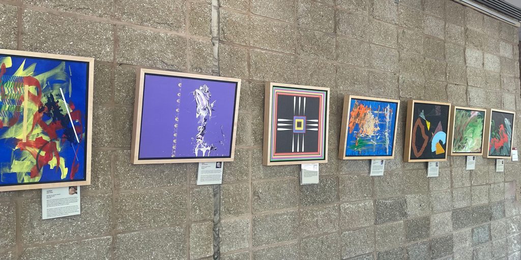 Framed paintings on exhibit at New Jersey Medical School Collaborative ARTS Exhibit 2023.