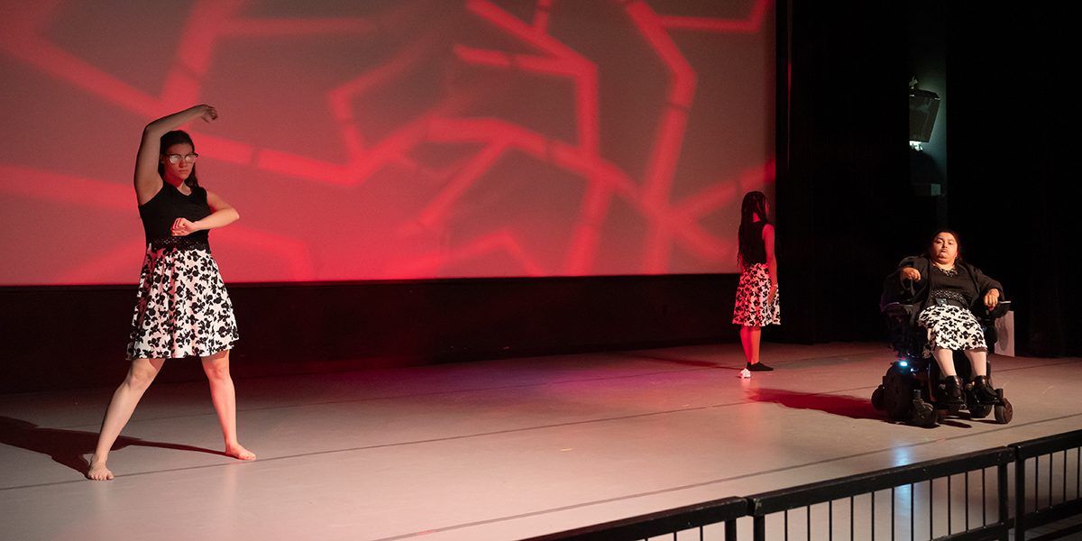 Choreographer Isabelle Villacis and 2 dancers performing on stage at the Robert Schonhorn Arts Center during Full Circle 2023.