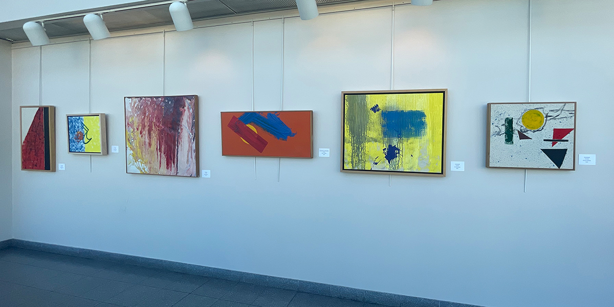Abstract acrylic paintings hanging on a gallery wall