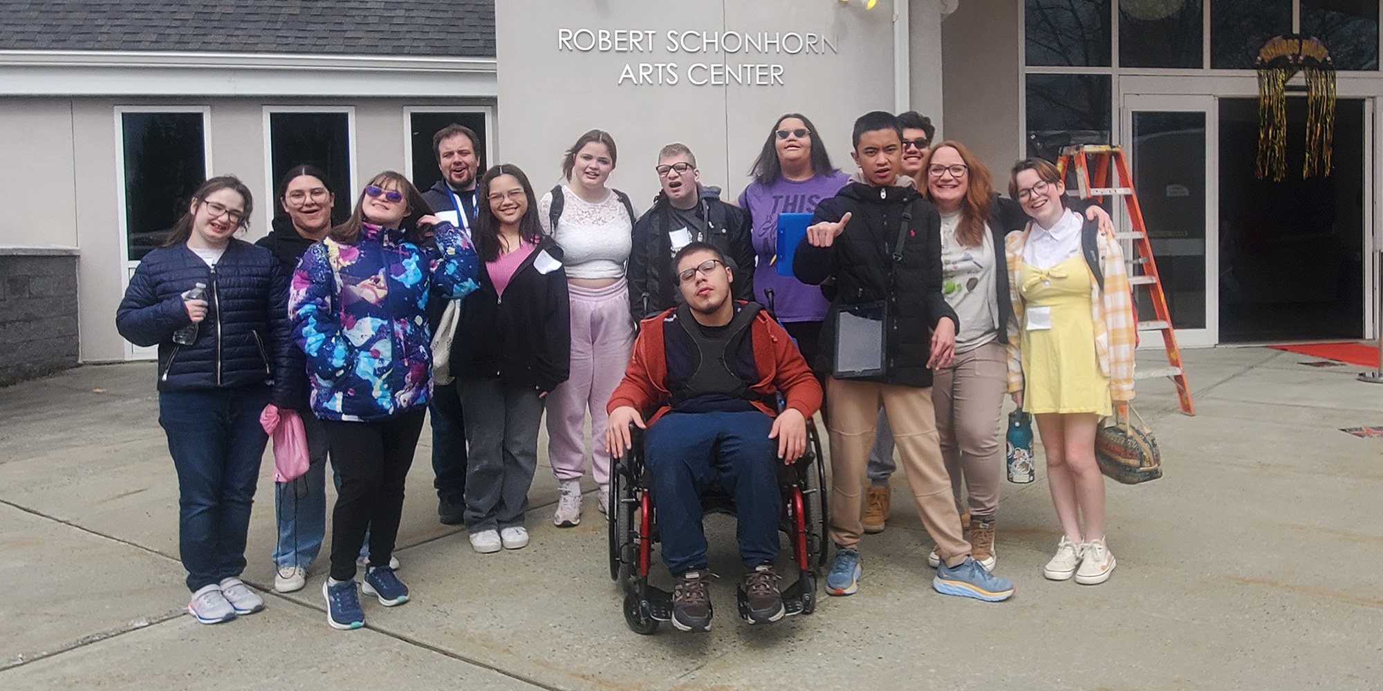 A group of high school students outside the Robert Schonhorn Arts Center at Matheny Arts Access.