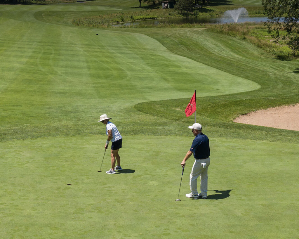 Two people golfing at Stanton Ridge Country Club.