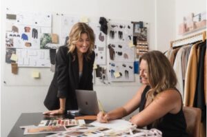 Two women in a fashion design office.