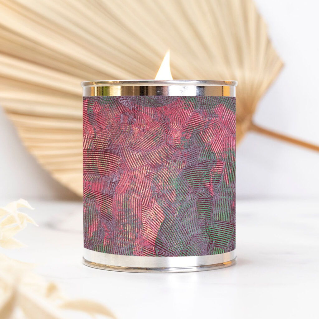 Paint can candle featuring artwork by Nancy Soto.