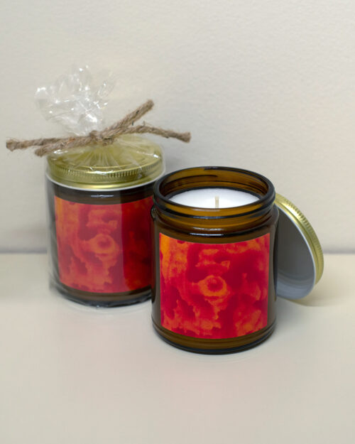 Amber jar candle featuring artwork by Paul Santo.