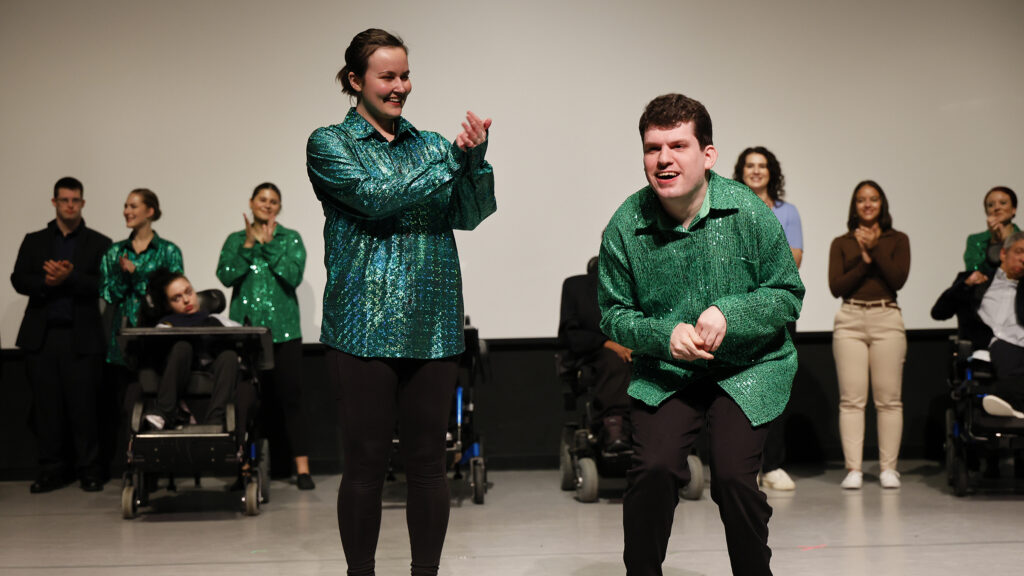 George Hoehn and other artists from Arts Access bowing onstage at Full Circle 2025.