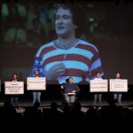 Artist Christopher Saglimbene performing on stage in the Robert Schonhorn Arts Center.