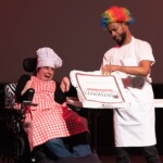 Artist Jessica Evans performing on stage in the Robert Schonhorn Arts Center.